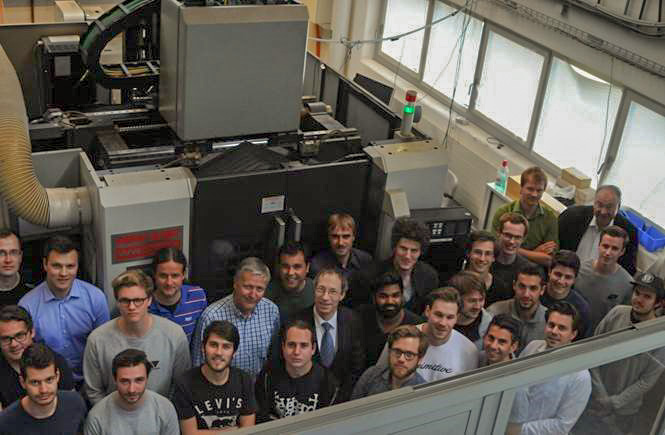 Professor Wegener surrounded by students and machinery