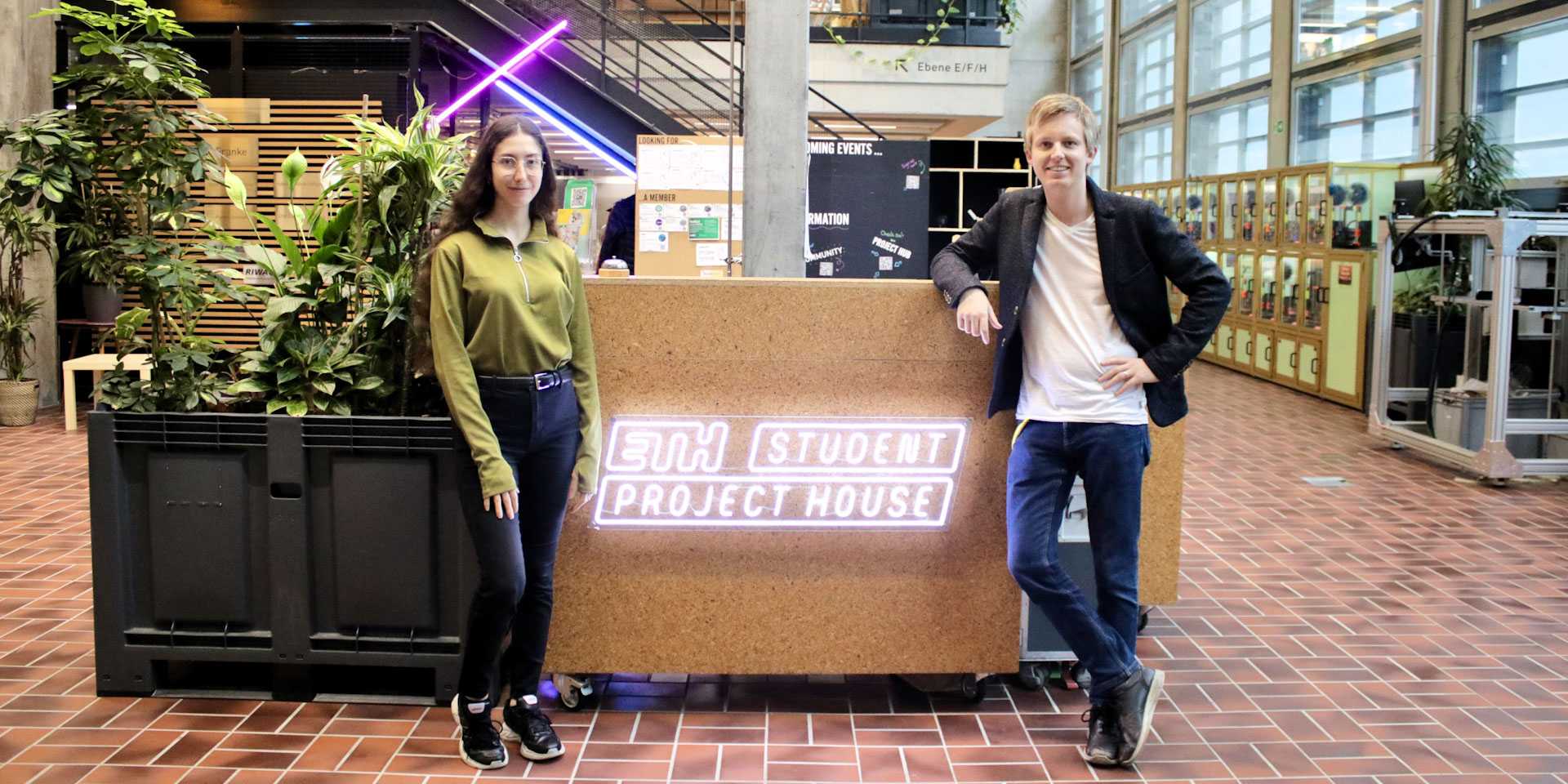 Serena Stefanoni and Rafael von Sury standing in the entrance area of the Student Project House.